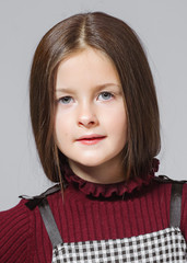 portrait of little model girl in studio