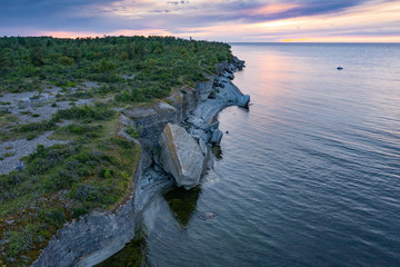 Wall Mural - Stone wall on the Baltic sea in the summer. Pakri coast, island in Estonia, Europe.