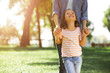 © Afshar Tetyana - smiling girl looking up at her mother in the park, cropped shot