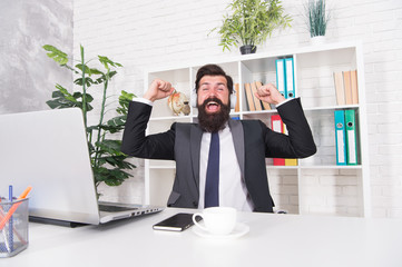 Enjoying success. Happy manger celebrate success in office. Bearded man being excited about success. Businessman make winner gesture. Success and career