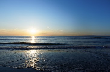 Sunset at the sea with waves