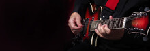 Guitarist Hands And Guitar On A Black Background Close Up. Playing Electric Guitar. Copy Spaces. 