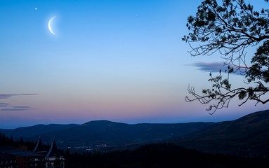 New moon . Religion background . The sky at night with stars. Ramadan background . Prayer time . Moon and beautiful night with stars