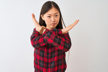 Sticker - Young chinese woman wearing casual jacket standing over isolated white background Rejection expression crossing arms doing negative sign, angry face