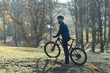 © Mountains Hunter - Cyclist in pants and fleece jacket on a modern carbon hardtail bike with an air suspension fork rides off-road.