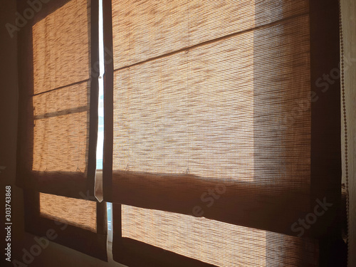 The double golden roman blinds helps prevent sunlight from entering the bedroom.