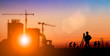 Silhouette of Survey Engineer and construction team working at site over blurred industry background with Light fair.Create from multiple reference images together