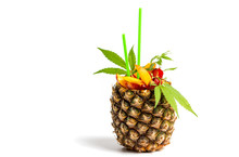 Fruit Salad And Juice With Marijuana In A Pineapple Shell Isolated