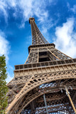 Fototapeta Paryż - Beautiful view of the Eiffel Tower against a bright blue sky on a sunny day. Vertical.