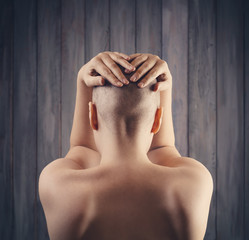 Portrait of a hairless woman from back