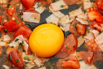 Canvas Print - Consecutive steps of preparing scrambled eggs with tomatoes and ham, seasoned with herbs