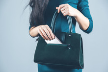 Woman Hand Phone With Bag On Gray Background