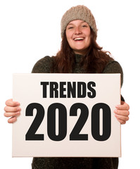 Wall Mural - Frau hält Schild mit Trends 2020