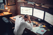 Young male trader at office work concept hard-working person
