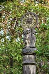 Wall Mural - Ashoka wheel of Dharma over four lion heads in Thailand