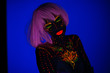 © ladie_c - Portrait of Beautiful Fashion Woman in Neon UF Light. Model Girl with Fluorescent Creative Psychedelic MakeUp, Art Design of Female Disco Dancer Model in UV, Colorful Abstract Make-Up. Dancing Lady