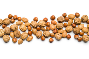 Wall Mural - top view of mix of nuts scattered on white background with copy space