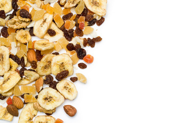 Wall Mural - top view of dried fruits scattered on white background with copy space