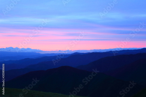 Fotomural BEAUTIFUL SUNSET FROM TOP OF THE MOUNTAIN