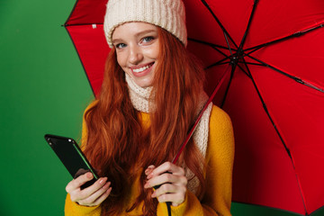 Canvas Print - Positive redhead woman using mobile phone.