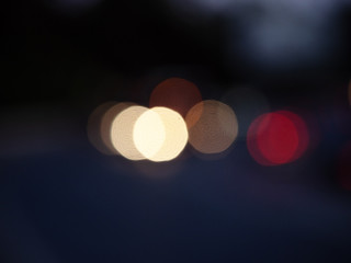 Colored round bokeh on a dark blue background