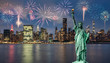 statue of liberty in front of Manhattan skyline,in Dumbo area of Brooklyn at night, and fireworks