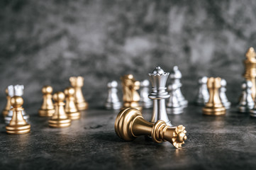 Wall Mural - Gold and Silver Chess on chess board game for business metaphor leadership concept