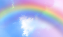 There Are Clouds And Sky With Rainbow As Pastel Background.
