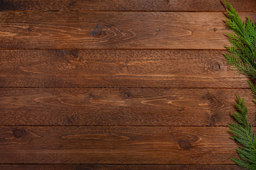 Christmas, winter, new year concept. Cypress branches on dark, wooden  background. Flat lay, top view.