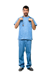 Wall Mural - Full-length shot of Surgeon doctor man with surprise facial expression over isolated white background