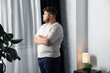 © New Africa - Overweight man suffering from depression at home