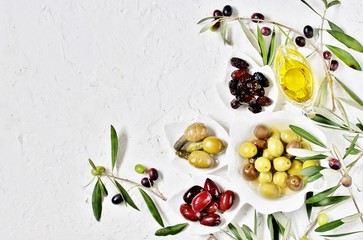 Wall Mural - olive products -  oil, dried olives, pickled, stuffed with cornichons. top view. copy space