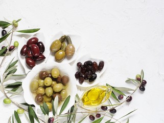 Wall Mural - olive products -  oil, dried olives, pickled, stuffed with cornichons. top view. copy space