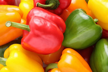 Fresh Ripe Colorful Bell Peppers As Background, Closeup