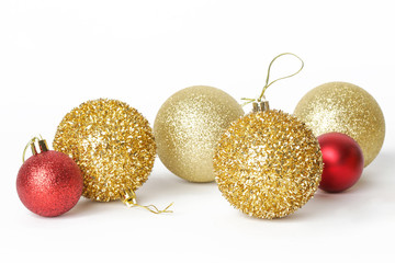 Gold and red Christmas shiny balls isolated on white background. Large glitter Christmas ornaments.