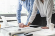 © successphoto - Image of engineer meeting for architectural project. working with partner and engineering tools on workplace