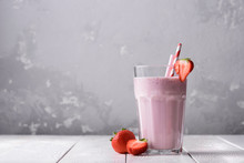 Strawberry Protein Shake On A White Wooden Background. Fresh Milkshake With Strawberries On A Light Table. A Glass Of Strawberry Smoothie.