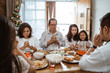 © Odua Images - people praying before having their lunch. christian family pray