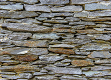 Texture Of A Wall Made Of Natural Rocks Of Different Sizes And Different Shapes