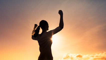 Wall Mural - Young strong confident woman flexing, and feeling determined. 