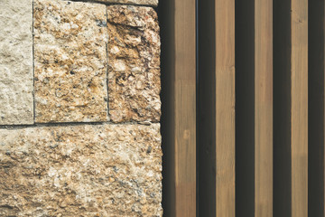 Wall Mural - Building facade with ancient stone blocks and modern vertical wooden planks