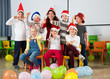 © JackF - Pupils with teacher in Santa hats giving thumbs up