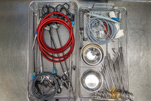 A Tray For Surgical Instruments Contains Various Assorted Instruments For Performing An Operation