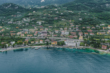 Aerial drone shot view of village Malcesine coastline by lake garda