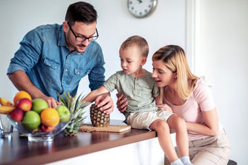 Canvas Print - Young family in the kitchen