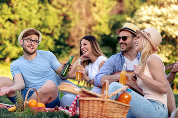 Canvas Print - Happy friends on picnic in park