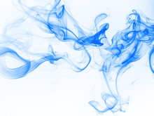 Blue smoke abstract on white background. movement of ink water on white