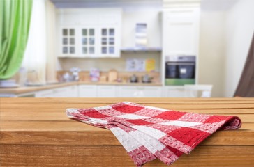 Poster - Wooden board stand on tablecloth over grunge background