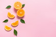 Fresh orange pieces on color background