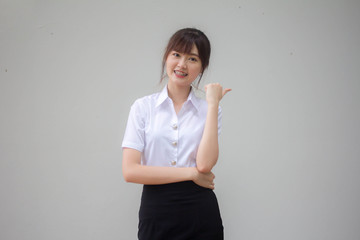 Wall Mural - thai adult student university uniform beautiful girl pointing